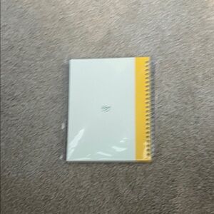 Yellow and White Spiral Notebook